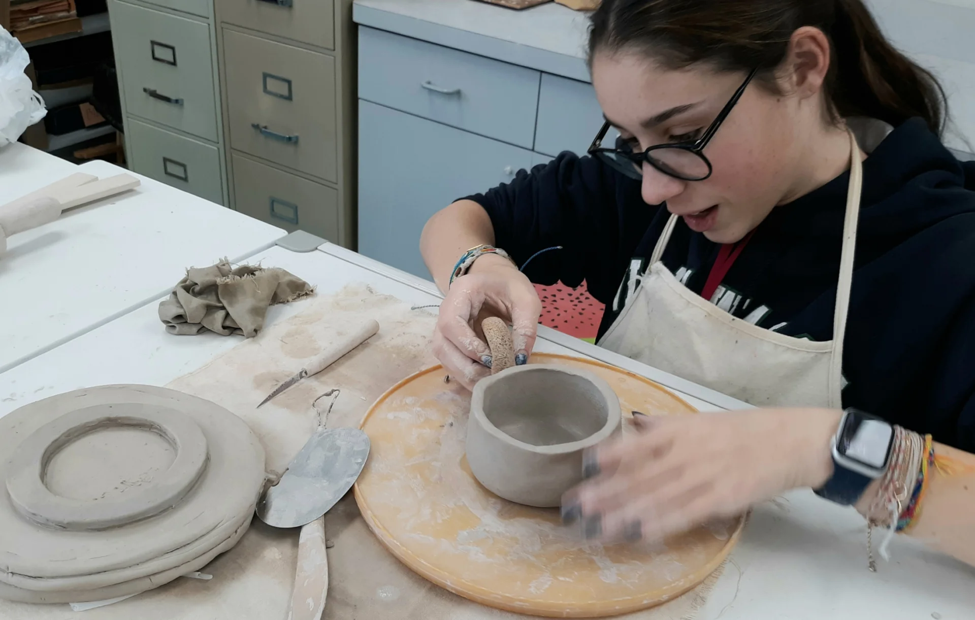 student making a bowl