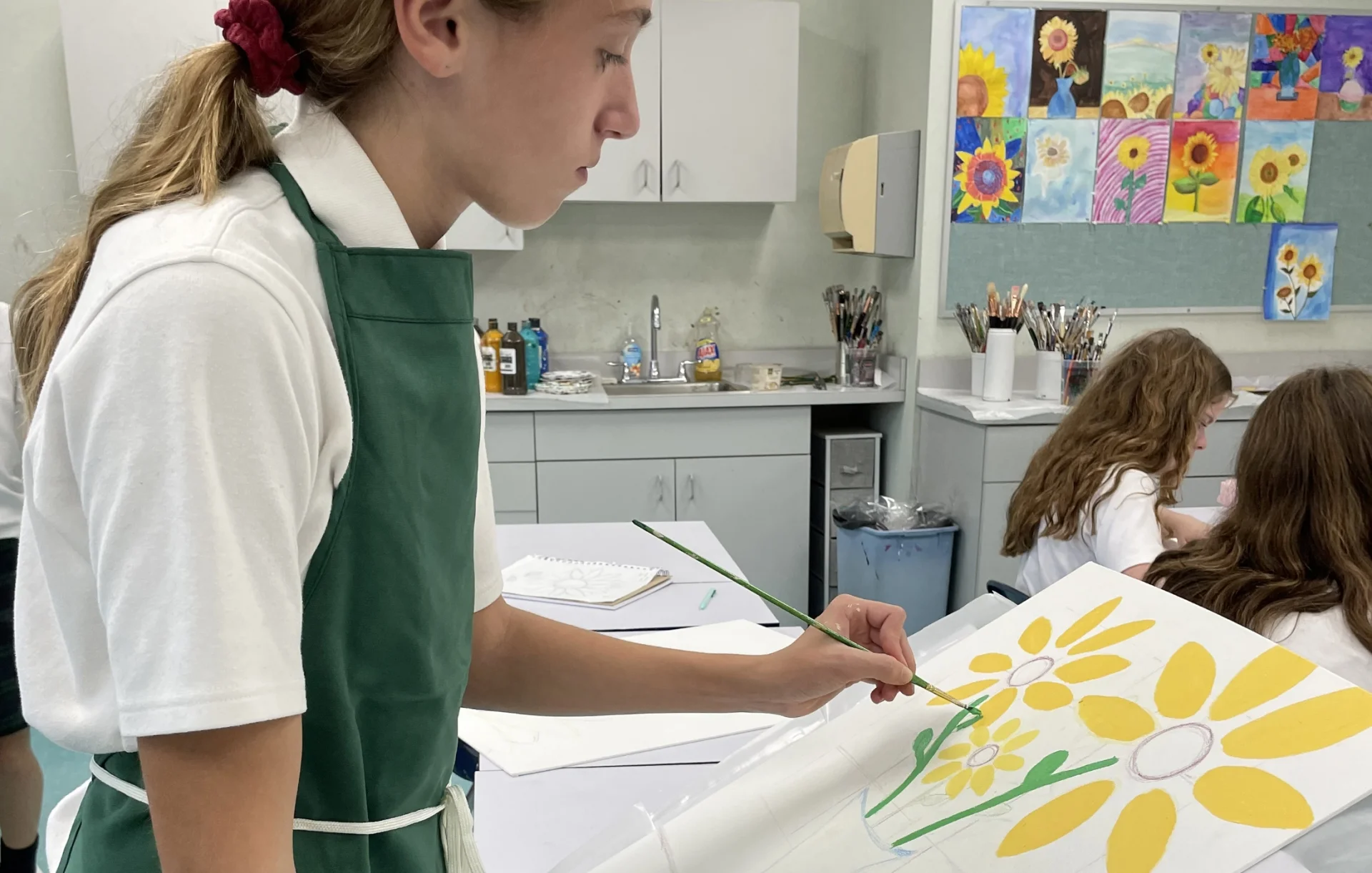 student painting flowers