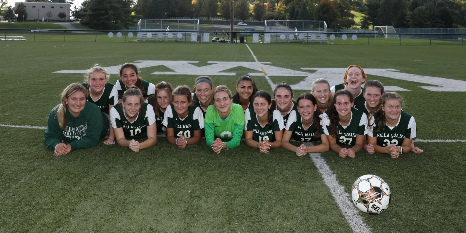 soccer team laying in the field