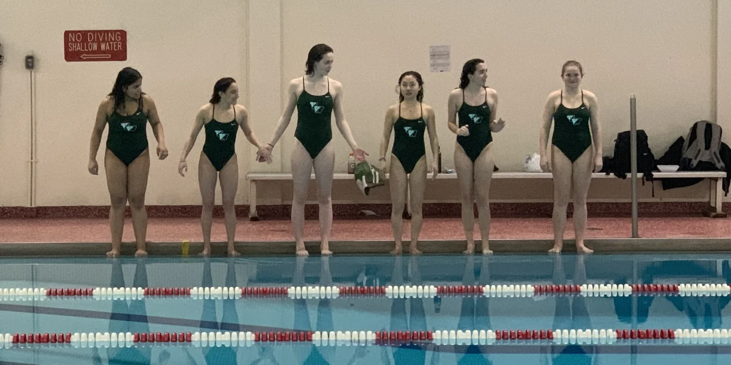 VWA swim team members holding hands