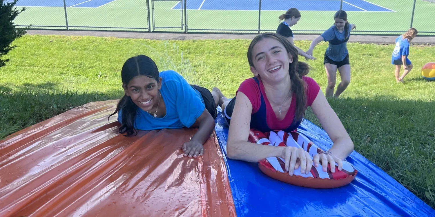 spring clinic students on water slide