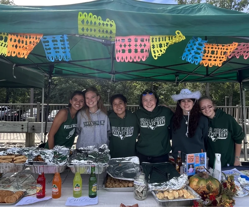 students in a mexican food booth